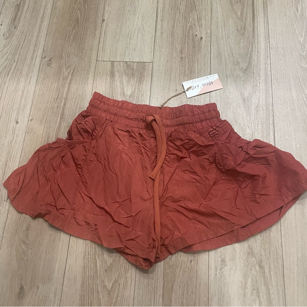 Burnt orange flared shorts